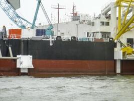 The cargo ship with the crane, the top view. Pipelaying barge. photo