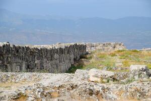 walls of the ancient ruins of limestone blocks. Ruins of the city of Hierapolis, Turkey. photo