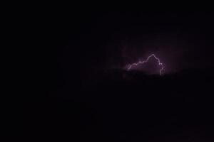 Lightnings in storm clouds photo