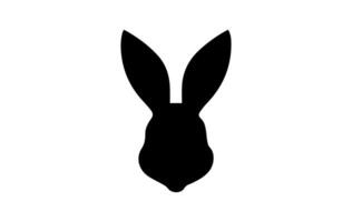 Silhouette of a rabbit head. Easter Bunny. Isolated on white background. A simple black icon of hare. Cute animal. Ideal for logo, emblem, pictogram, print, design element for greeting card, vector