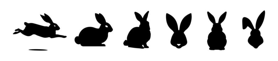 Set of Rabbit silhouettes. Easter bunnies. Isolated on white background. A simple black icons of hares. Cute animals. Ideal for logo, emblem, pictogram, print, design element for greeting card. vector