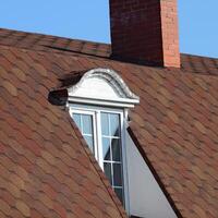 House with a roof made of metal sheets photo