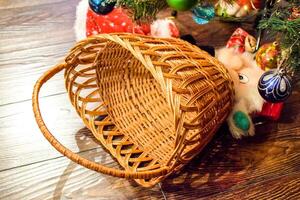 Wicker basket under the Christmas tree. photo
