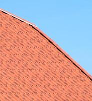 The roof of corrugated sheet red orange photo