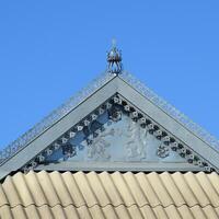 Decorative elements on ridge of roof photo
