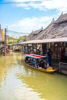 Pattaya, Thailand - December 29, 2023. Floating open air market with small houses - shops on the pond in Pattaya, Thailand. High quality photo