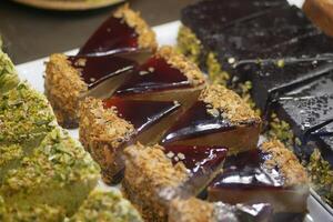 chocolate and cream cake display for sale at cafe photo