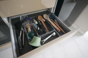 cutlery fork with knife and spoon in a drawer photo