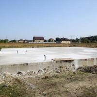 Filled foundation of the house and floors. Home construction. photo