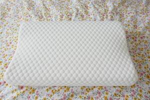 Orthopedic pillow on a bed photo