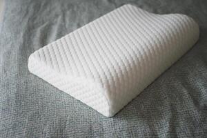 Orthopedic pillow on a bed photo