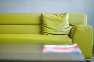 modern yellow sofa with pillows in living room at home photo