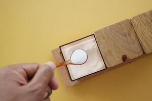 top view of spoon pick salt from a container photo