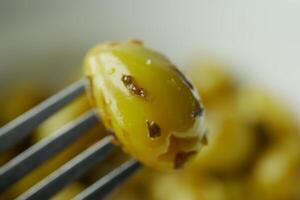 Turkish Grilled olives in a bowl photo