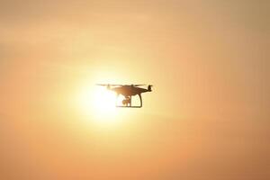 drone silhouette against the background of the sunset photo