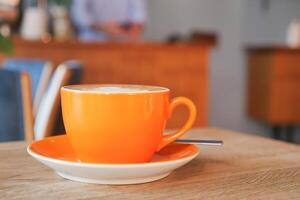 Coffee cup on wood table photo