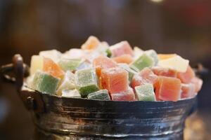 turkish delight or lokum of red, green, orange and yellow colors. photo