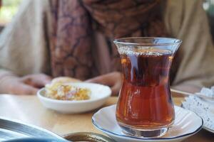 Traditional turkish tea on cafe table . photo