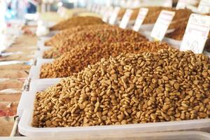 stack of dried cat food display for sale at local market photo