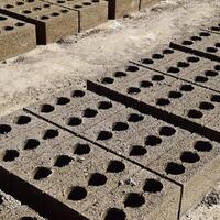 Cinder blocks lie on the ground and dried. on cinder block production plant. photo