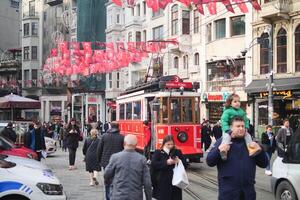 turkey Istanbul 12 may 2023. Nostalgic red tram in Taksim Square.. photo