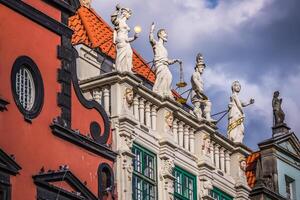 Statue of justice with scales and a sword in the historic center of Gdansk. photo
