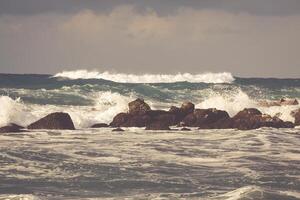 Powerful waves of Atlantic ocean near Tenerife coast, focus on waves photo