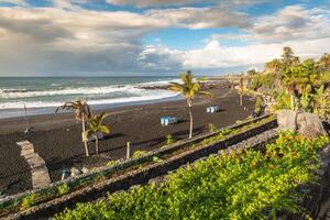 The coast of Atlantic ocean in Puerto De La Cruz, one of the most popular touristic towns, Canary islands, Spain photo