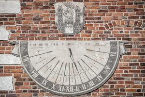 Sandomierz, town in Poland. Old town hall sundial. photo