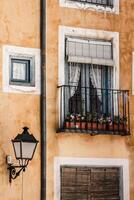 Old color houses facades in Cuenca, central Spain photo