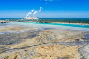 Surface coal mining and power station in Poland. Destroyed land. View from above. Surrealistic landscape. photo