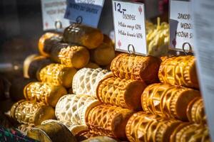 Traditional polish smoked cheese oscypek on outdoor market in Zakopane photo