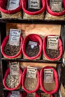 Spices, seeds and tea sold in a traditional market in Granada, Spain photo