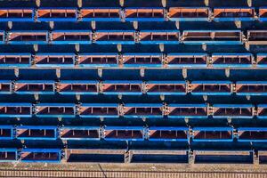 Cargo trains. Aerial view of colorful freight trains on the railway station. Wagons with goods on railroad.Aerial view photo