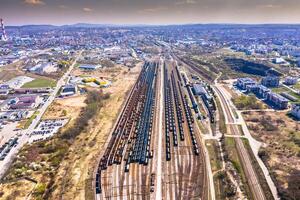 Cargo trains. Aerial view of colorful freight trains on the railway station. Wagons with goods on railroad.Aerial view photo