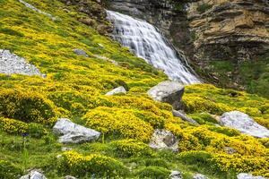 Cascada Cola de Caballo waterfall under Monte Perdido at Ordesa Valley Aragon Huesca Pyrenees of Spain photo