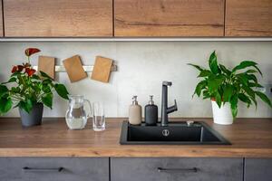 Jug with clear cold water on kitchen table in the home photo