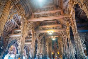 Pattaya, Thailand - December 31, 2023. Interior of Sanctuary of Truth wooden temple in Pattaya, Thailand. Sanctuary of Truth temple. photo