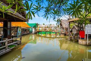 Pattaya, Thailand - December 29, 2023. Floating open air market with small houses - shops on the pond in Pattaya, Thailand. High quality photo