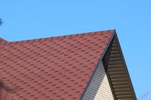 Decorative metal tile on a roof photo