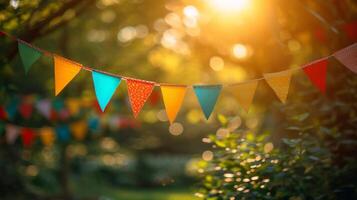 AI generated multi-colored garland in the form of triangular flags on a blurred background of a summer garden photo