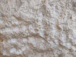 marrón crema Roca pared textura cuales es por lo general instalado en el paredes de casas o lujo villas foto