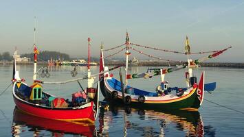 colorful fishing boats anchored in the harbor on Paiton beach Indonesia photo