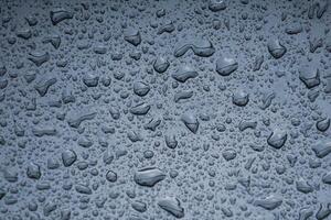 raindrops on the metallic surface in rainy days photo