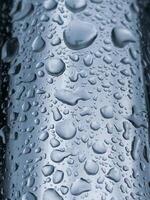 raindrops on the metallic surface in rainy days photo