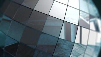 A close-up of a colorful reflective disco mirror ball slowly on a blurry colored background. Mirror ball, animation video