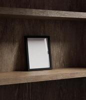 black wooden frame mockup standing on the wooden shelf lit by window light photo