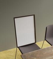 minimalist frame mockup poster on the dining chair lit by sunlight with aesthetic view photo