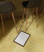 small simple minimalist frame mockup leaing on the bar chair photo