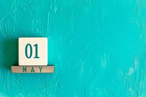 AI generated Labor Day date on textured turquoise wall with copy space photo